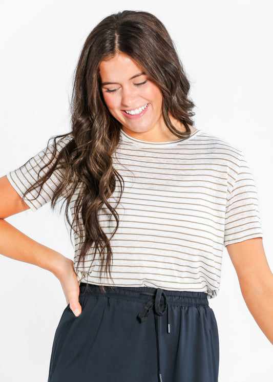 Woman wearing a stripped t-shirt with timeless design skirt