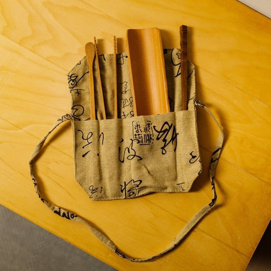 Juego de utensilios de té de bambú en bolsa de viaje