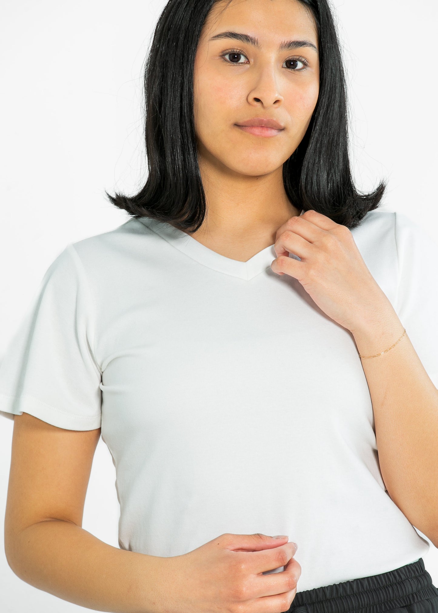 Top esencial con cuello en V y manga con volantes