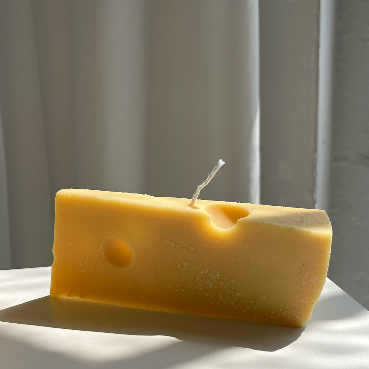 Vela de queso suizo